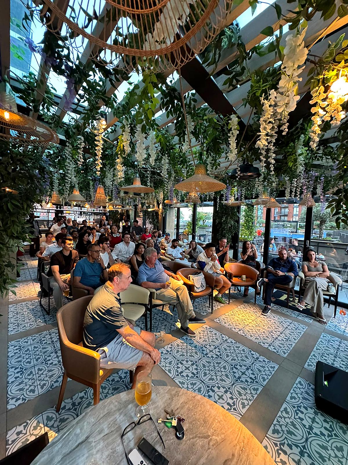 Neighbours together at a community gathering at Embassy Gardens