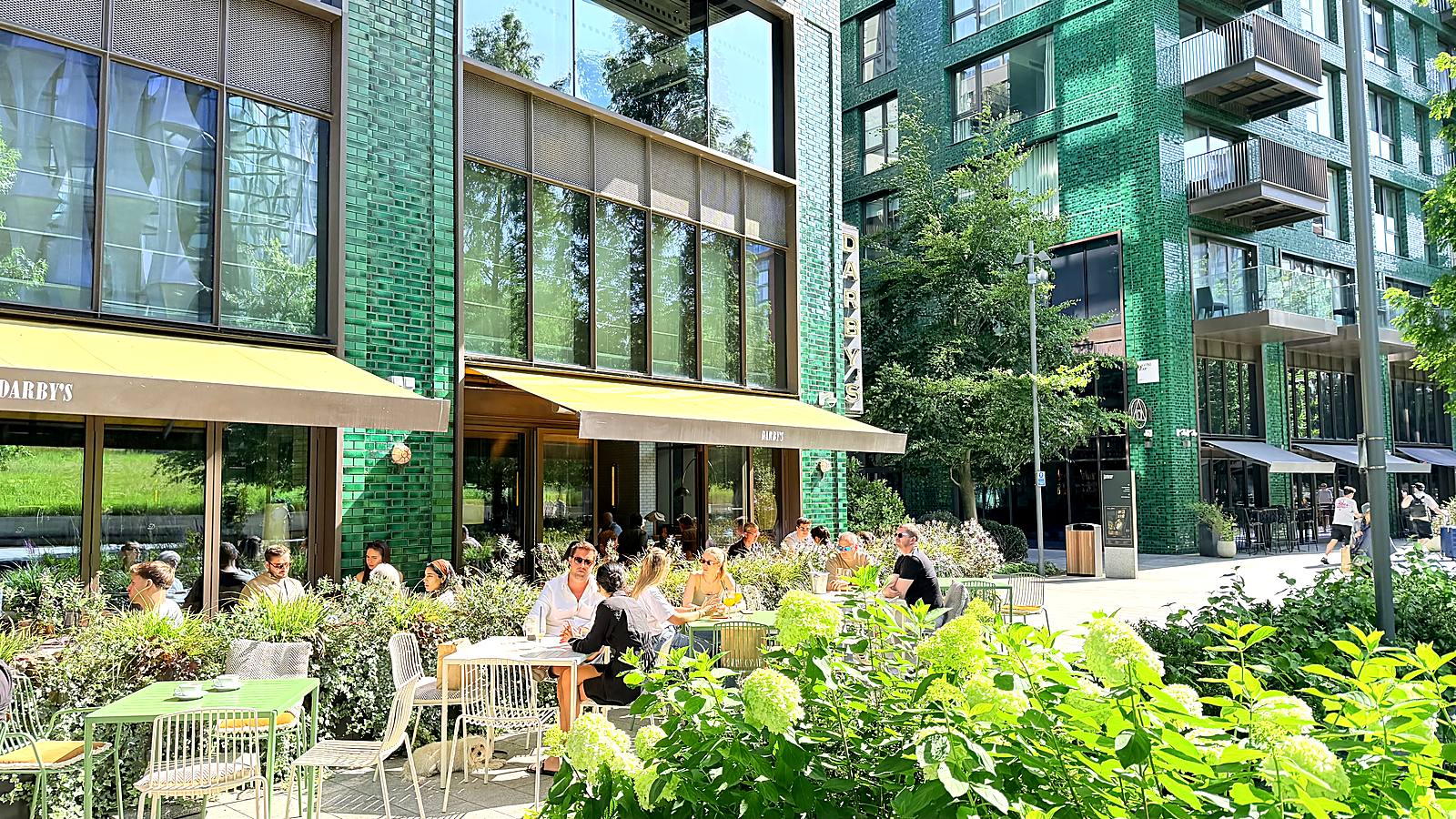 Neighbours dining outside Darby's at Embassy Gardens